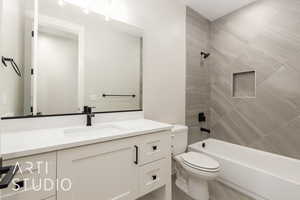 Full bath featuring vanity and bathing tub / shower combination
