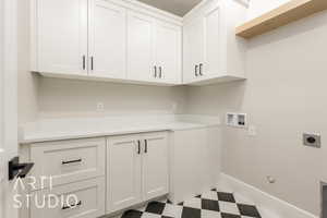 Washroom with cabinet space, hookup for an electric dryer, tile patterned floors, washer hookup, and gas dryer hookup