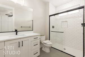 Full bathroom featuring a shower stall, vanity, and tile patterned flooring