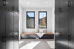 Mudroom with light tile patterned floors and recessed lighting
