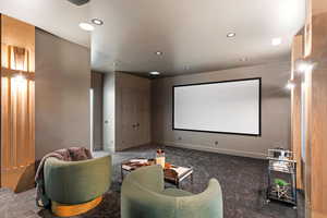 Cinema room with recessed lighting and carpet floors