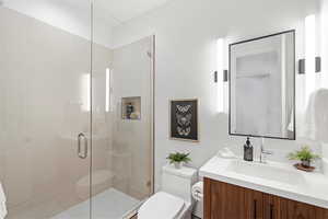 Full bathroom with a stall shower and vanity