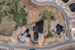 Aerial view of property and surrounding area featuring property boundaries highlighted