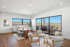 Dining space featuring recessed lighting, wood-type flooring, and a mountain view