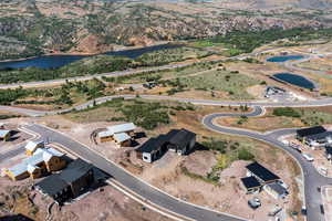 View of property location with a water and mountain view