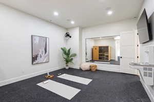 Workout area with recessed lighting and carpet floors