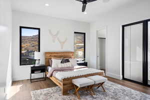 Bedroom featuring dark wood-style floors, recessed lighting, and a ceiling fan