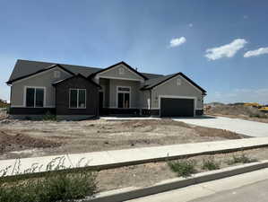TRADITIONAL ELEVATION WITH STUCCO & STONE (PICTURE OF PREVIOUS BUILT HOME-COLORS AND MATERIALS MAY VARY - TO BE BUILT)