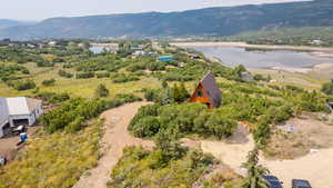View from above of property featuring a water and mountain view