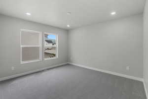 Unfurnished room with carpet flooring and recessed lighting