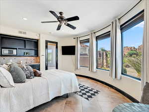 Bedroom featuring light tile patterned flooring, recessed lighting, and a ceiling fan