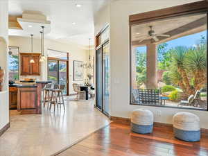 Entryway with a chandelier, a ceiling fan, recessed lighting, and light wood finished floors