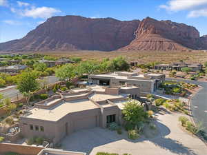 View of mountain backdrop featuring nearby suburban area