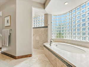 Full bathroom featuring a bath, tile patterned flooring, walk in shower, and recessed lighting