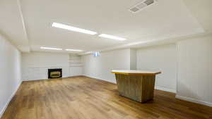 Basement Family room with fire place and new laminate flooring