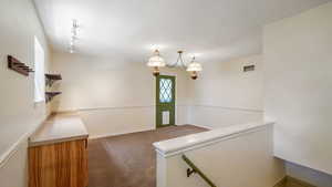 Formal dining area or additional living area with door to back deck.