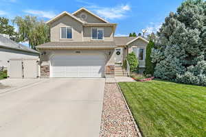 Lovely curb appeal with oversized driveway for additional parking