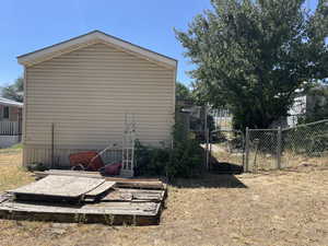View of property exterior with a gate