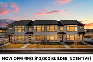 View of front of property featuring stucco siding, a standing seam roof, a metal roof, and a front lawn