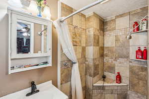 Bathroom featuring tiled shower
