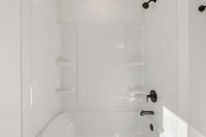Full bathroom featuring washtub / shower combination