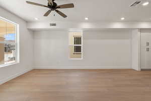Spare room with recessed lighting, light wood-style floors, and a ceiling fan