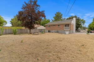 Back of property featuring a chimney