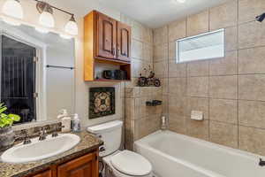 Full bathroom featuring vanity and washtub / shower combination