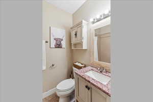 Bathroom featuring vanity, a shower with shower curtain, and tile patterned floors
