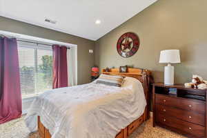 Bedroom with light carpet