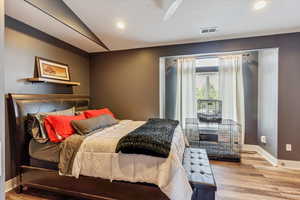 Bedroom featuring wood finished floors and recessed lighting