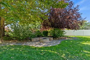 Fenced backyard with a patio