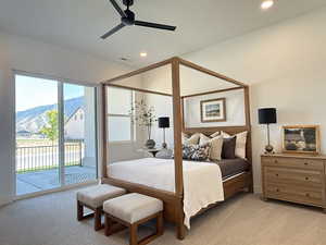 Bedroom with light carpet, access to outside, recessed lighting, a mountain view, and ceiling fan
