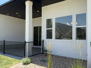 View of side of property featuring stucco siding