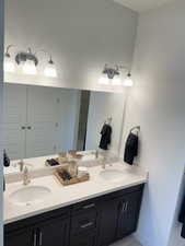 Full bathroom with double vanity