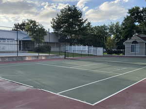 View of tennis court with community basketball court