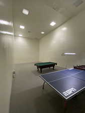 Rec room with pool table and concrete floors