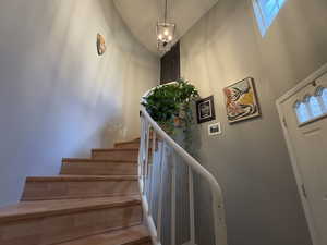 Stairway with a towering ceiling