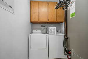 Laundry room with cabinet space and independent washer and dryer