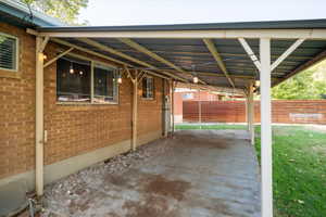 View of covered patio / terrace featuring a carport.