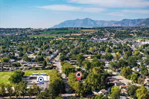 Aerial perspective of suburban area featuring a mountain backdrop.