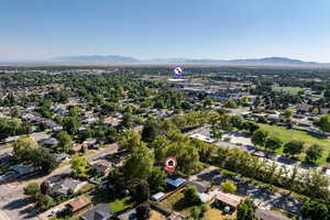 View of property location with a mountain backdrop and nearby suburban area