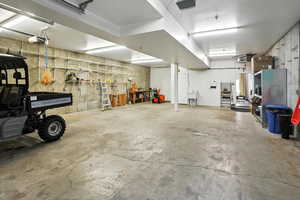 Garage with a heating unit and a garage door opener