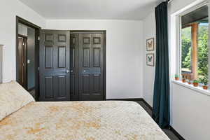 Unfurnished bedroom with a closet and carpet