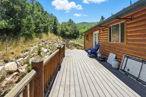 Wooden terrace featuring a mountain view