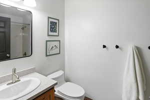 Bathroom featuring vanity and a shower