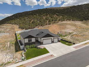View of subject property with a mountainous background