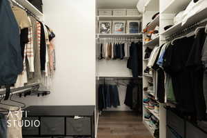 Spacious closet featuring wood finished floors