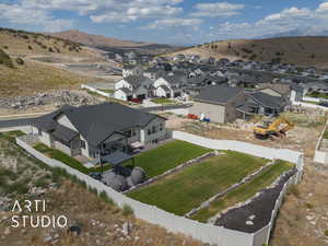 Aerial view of terraced backyard with a mountain backdrop