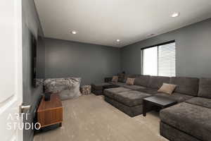 Bedroom 4, configured as TV room featuring light colored carpet and recessed lighting